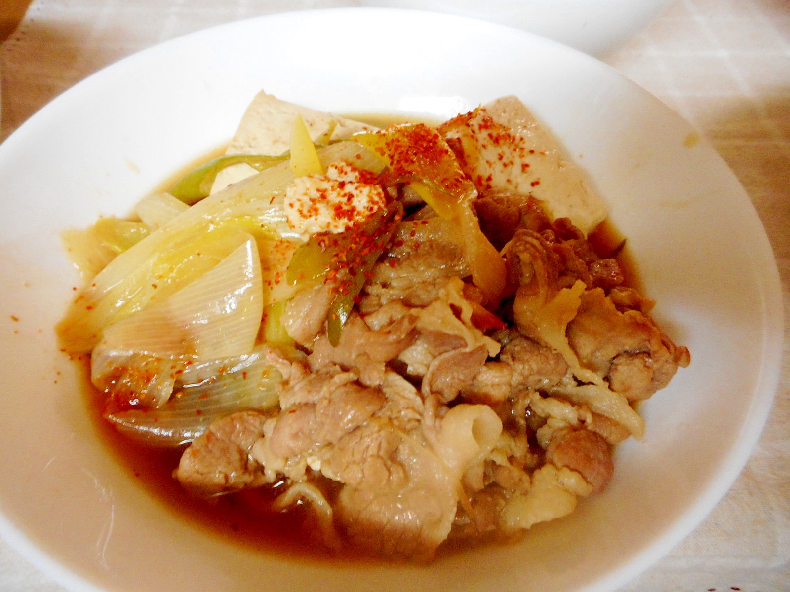 丸ごとネギの肉豆腐の写真